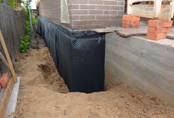 Happy homeowners after waterproofing job in Freeport